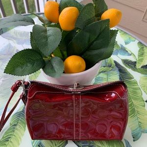 Embossed Logo Patent Leather Turn Lock Wristlet